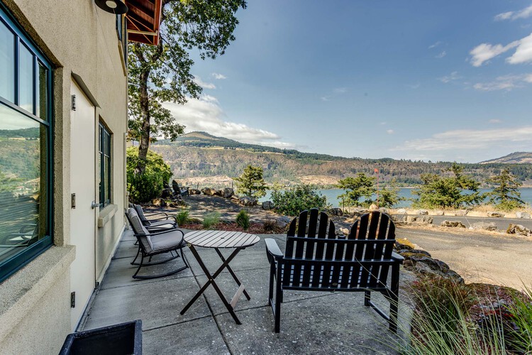 Patio with outdoor chairs and a table overlooking the Columbia River