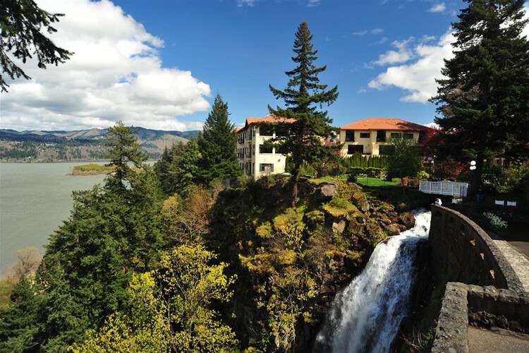 Neighboring waterfall and stone footbridge