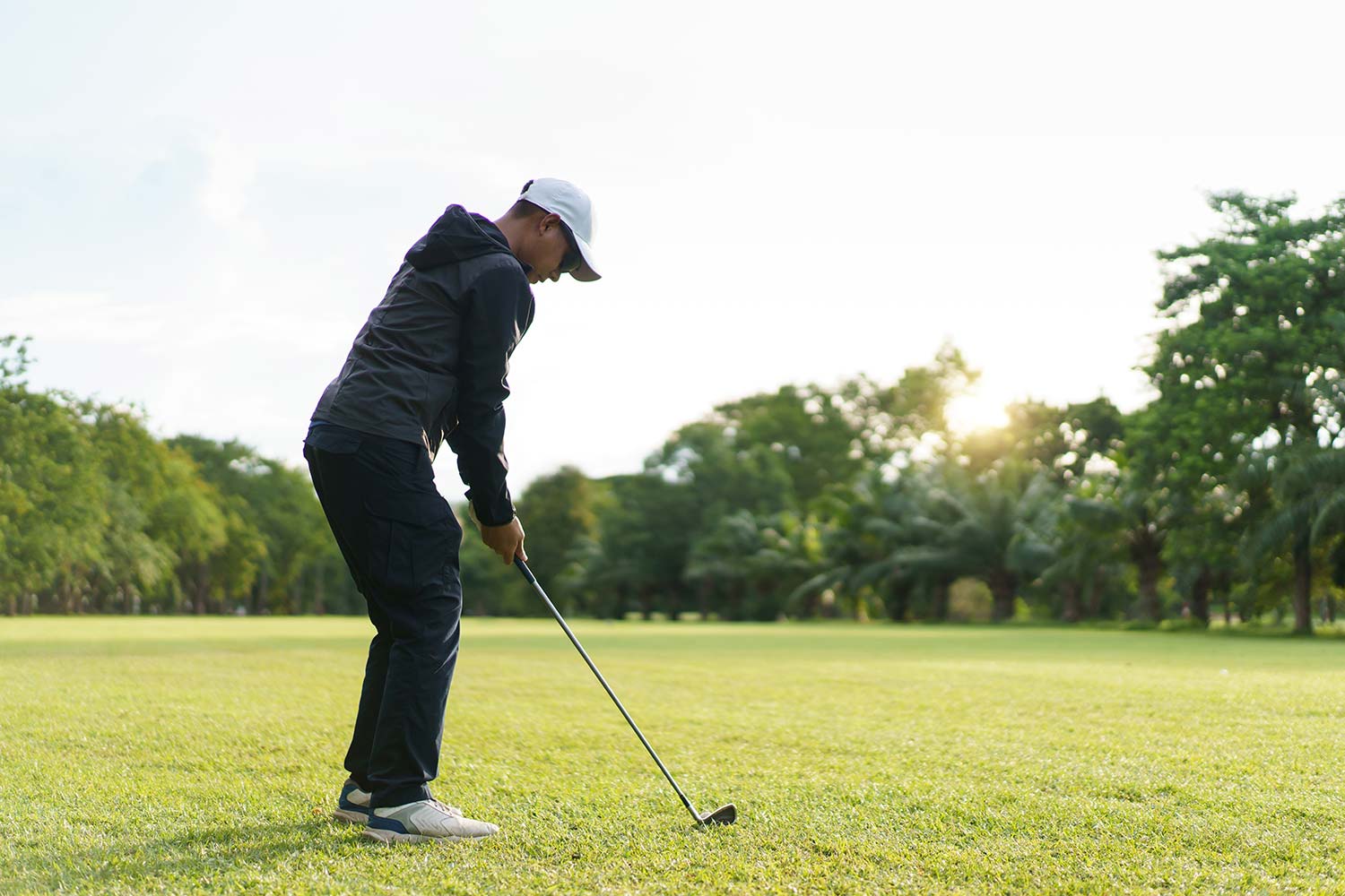 A man playing golf